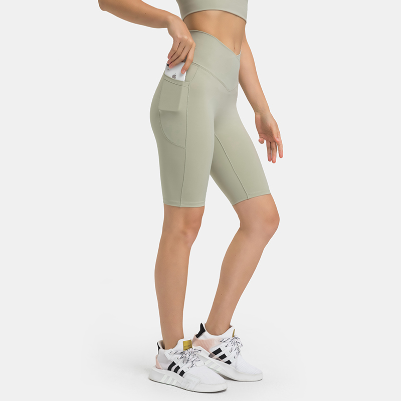 Women's cross waist sports leggings with double-sided pockets LIGHT BEA GREEN